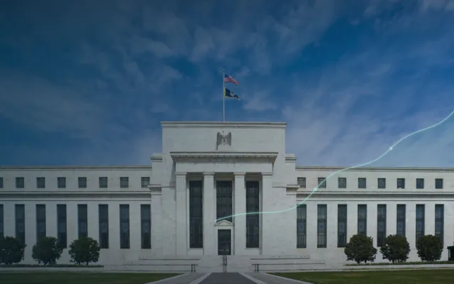 The Marriner S. Eccles Federal Reserve Board Building in Washington, D.C., with an abstract Treasury yield line overlay.