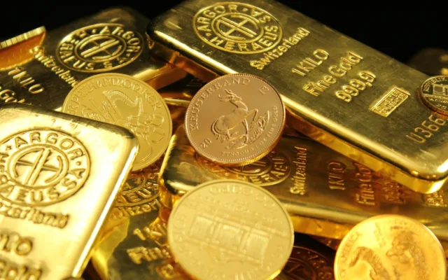 Gold and silver coins and bars illustrating the gold-silver ratio.