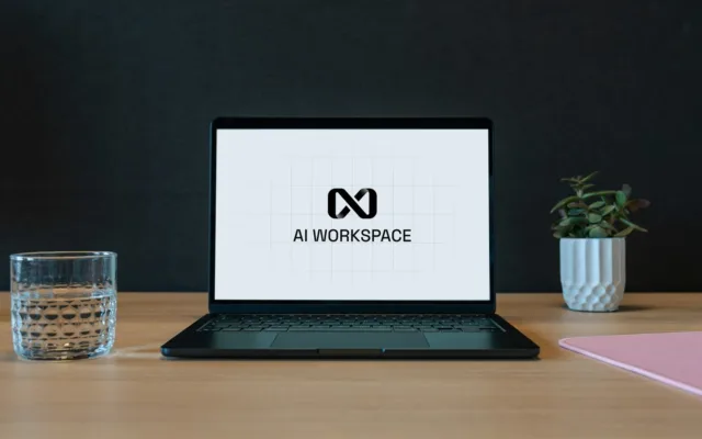 A laptop displaying an AI workspace on a small business desk.